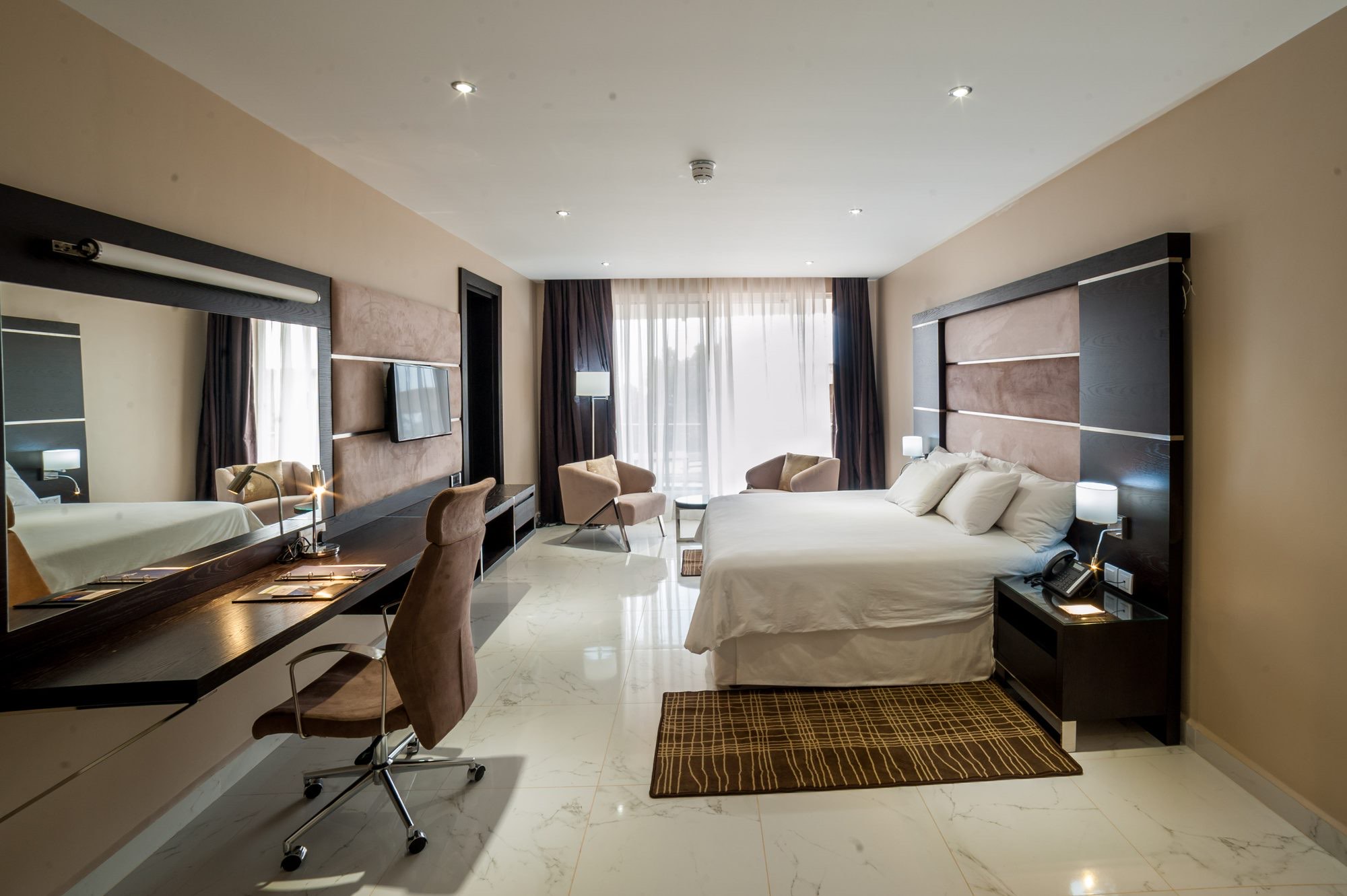 One Bedroom Suite living area with skyline windows
