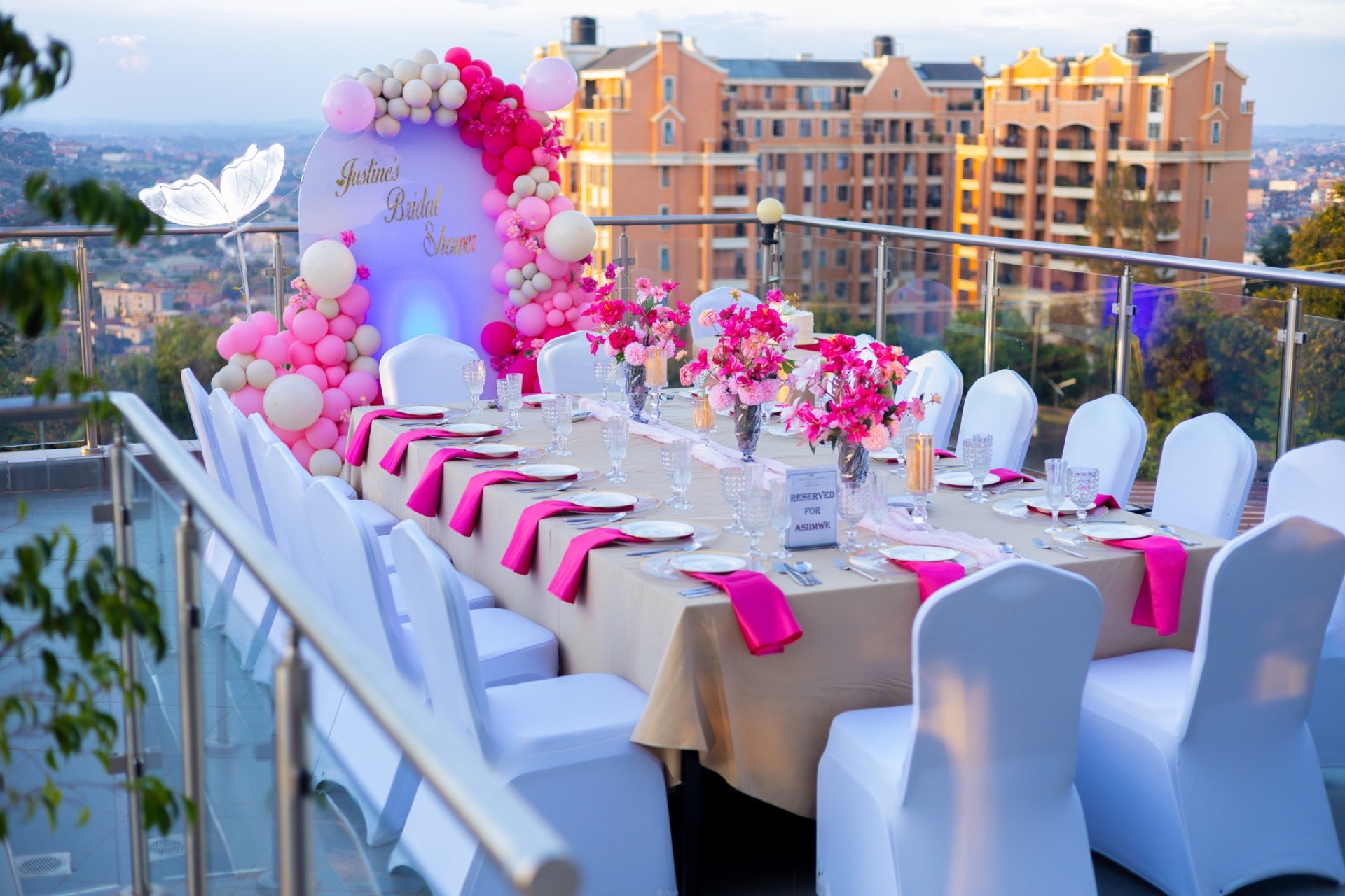 A styled celebration table on Aruba Terrace overlooking Kampala