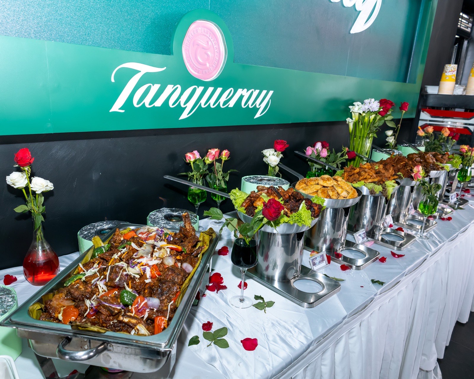 The buffet spread beneath the Tanqueray-branded bar at The Kampala Style Brunch, February 2024