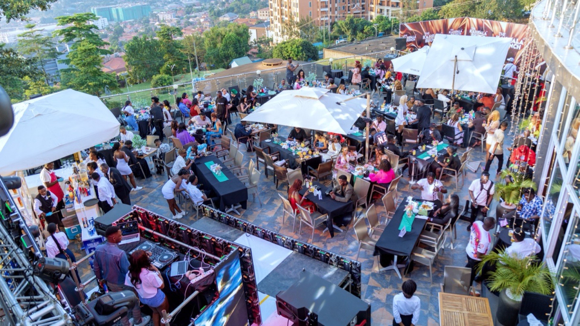 Guests seated at Lariza Terrace during a daytime brunch event at Skyz Hotel Kampala