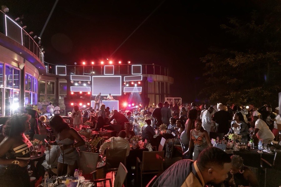 Lariza Terrace at night with a live DJ and stage lighting