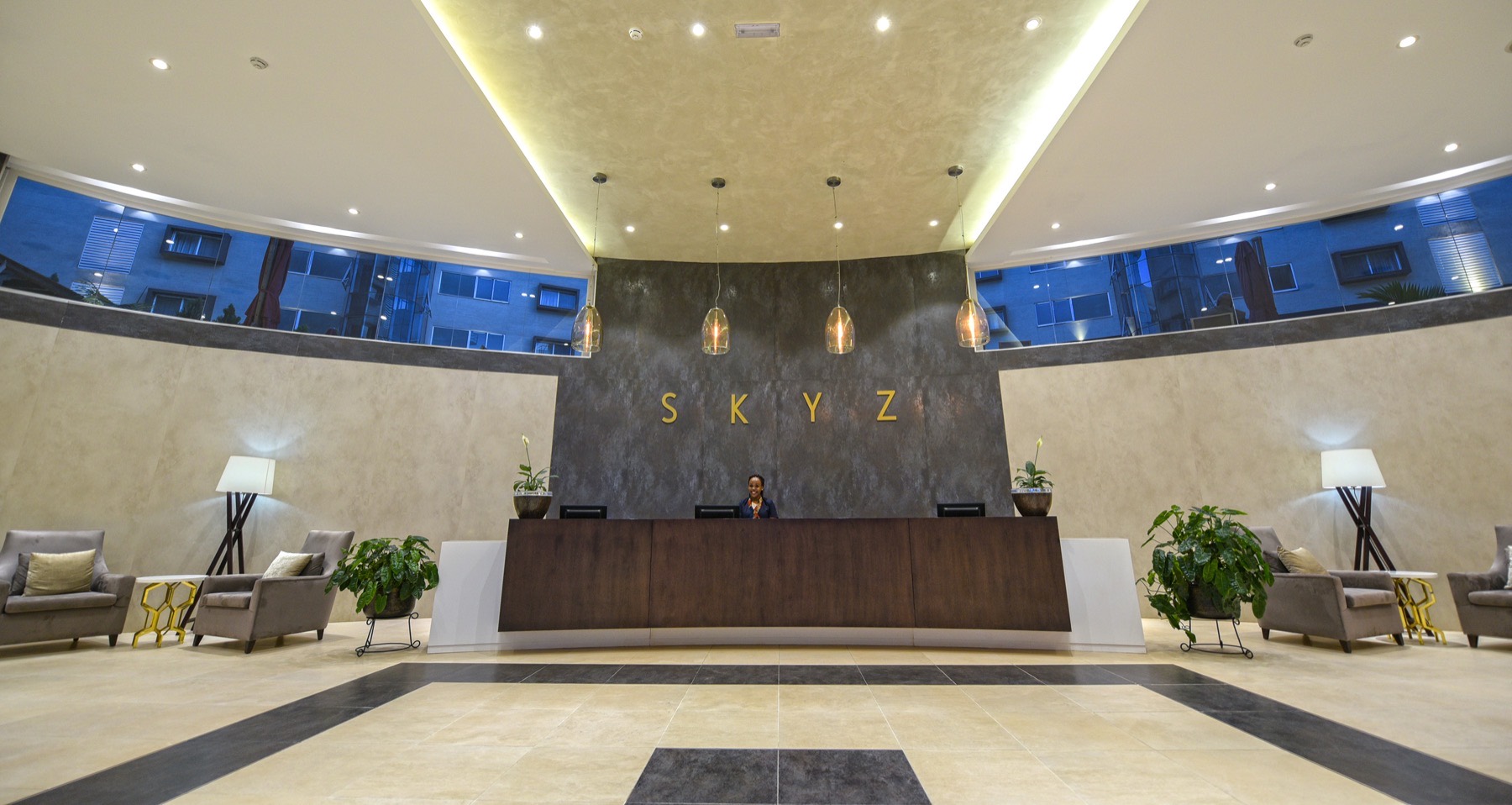The arrival lobby and reception desk at Skyz Hotel Kampala