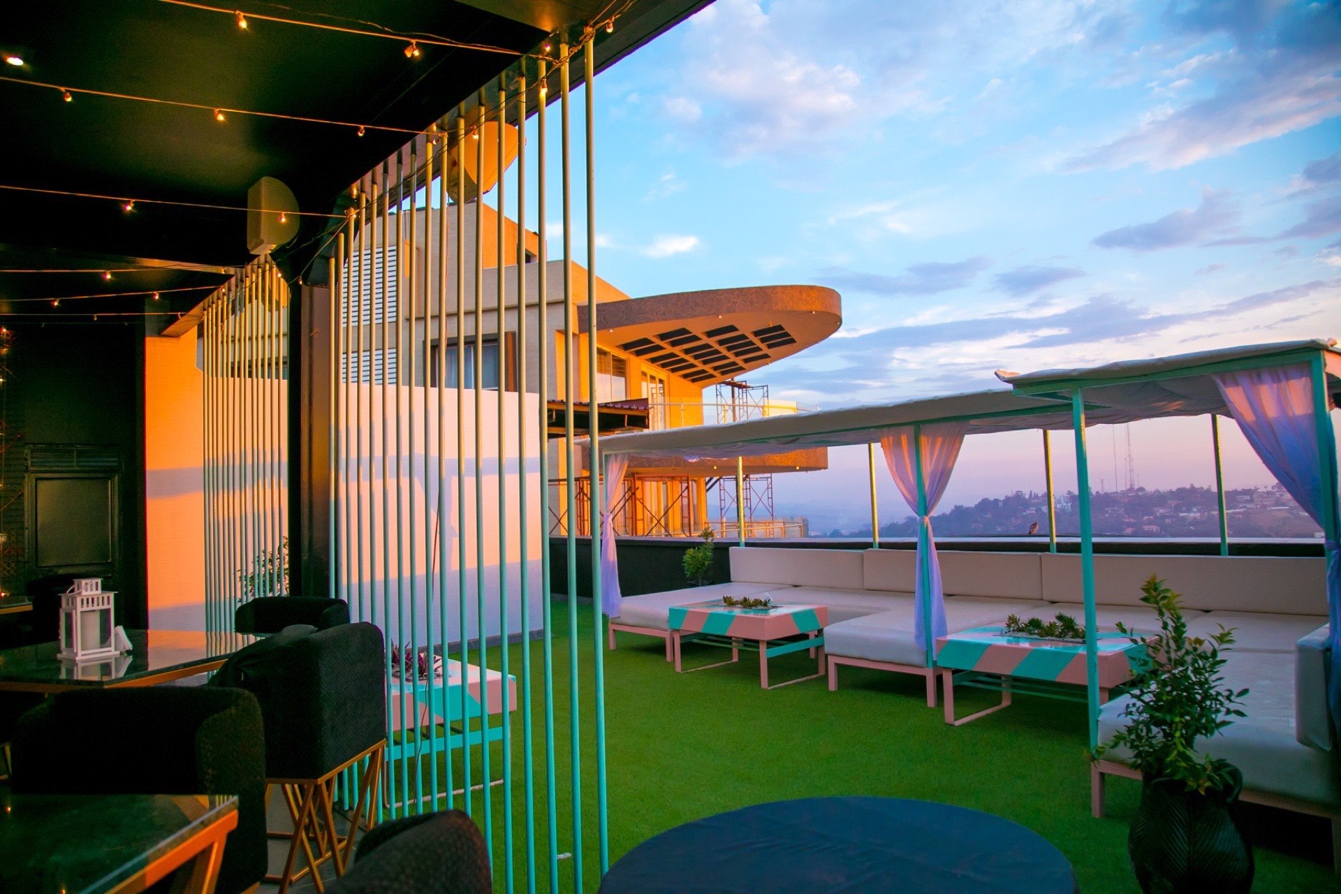 Rooftop event tables dressed in blue and white linens by day