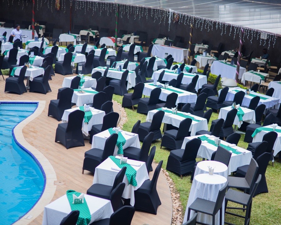 Casual poolside dining tables set beside the Tropicanna pool at the Tropicanna Poolside Restaurant