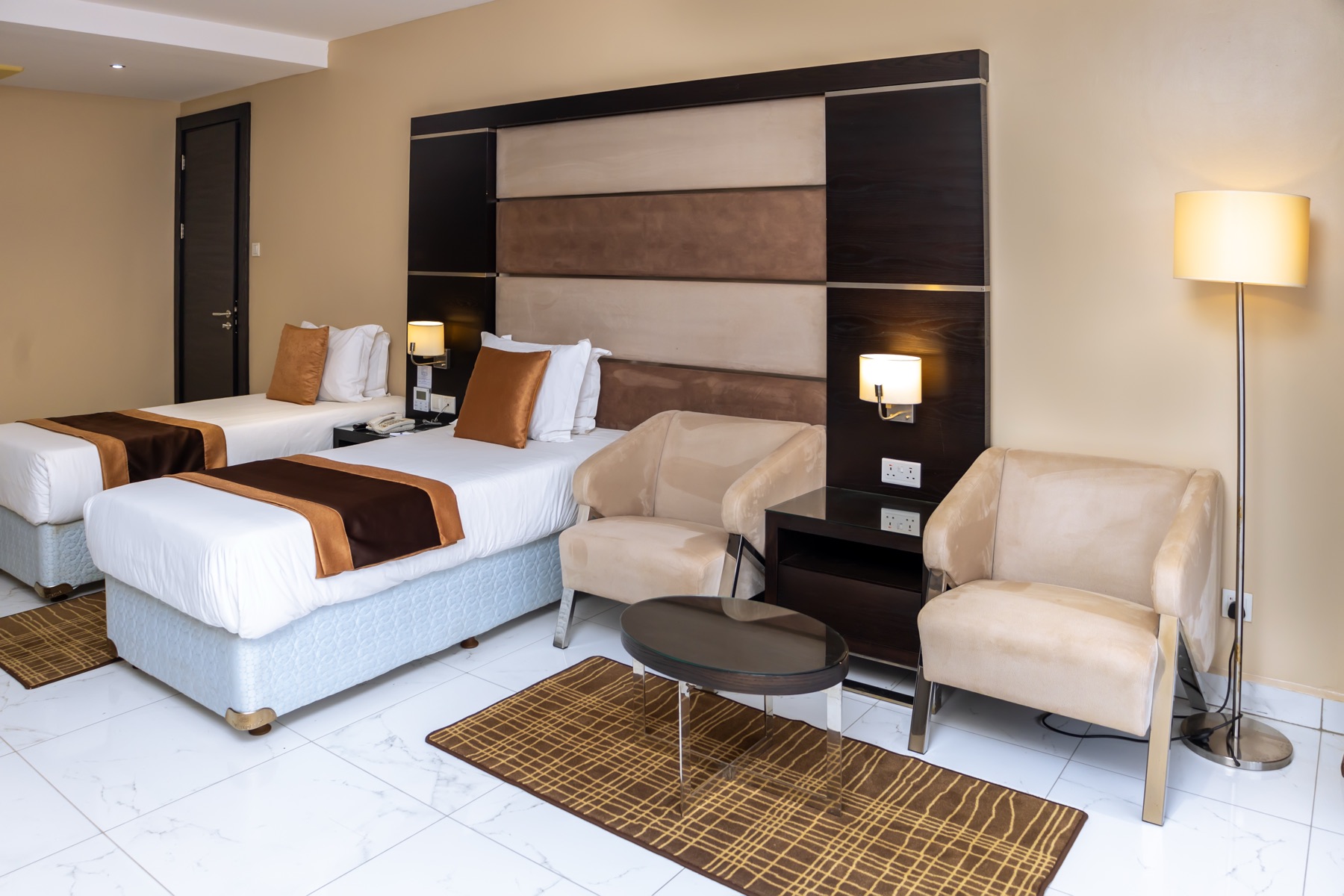 Twin Suite seating area with armchairs and coffee table